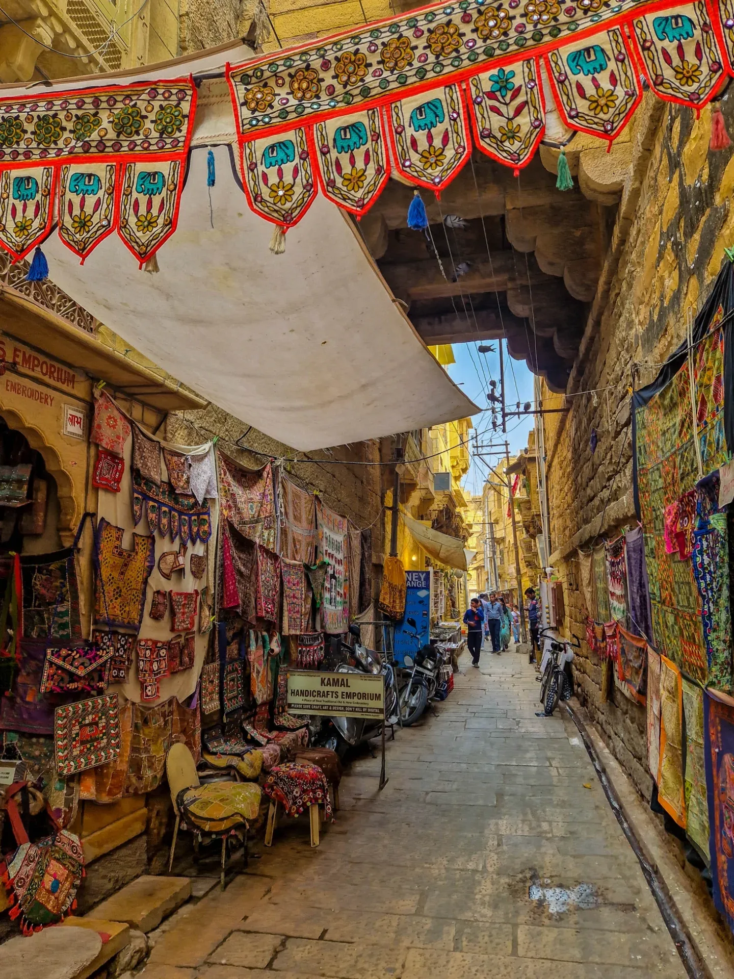 Narrow paved street inside the golden stone quarter of Jaisalmer