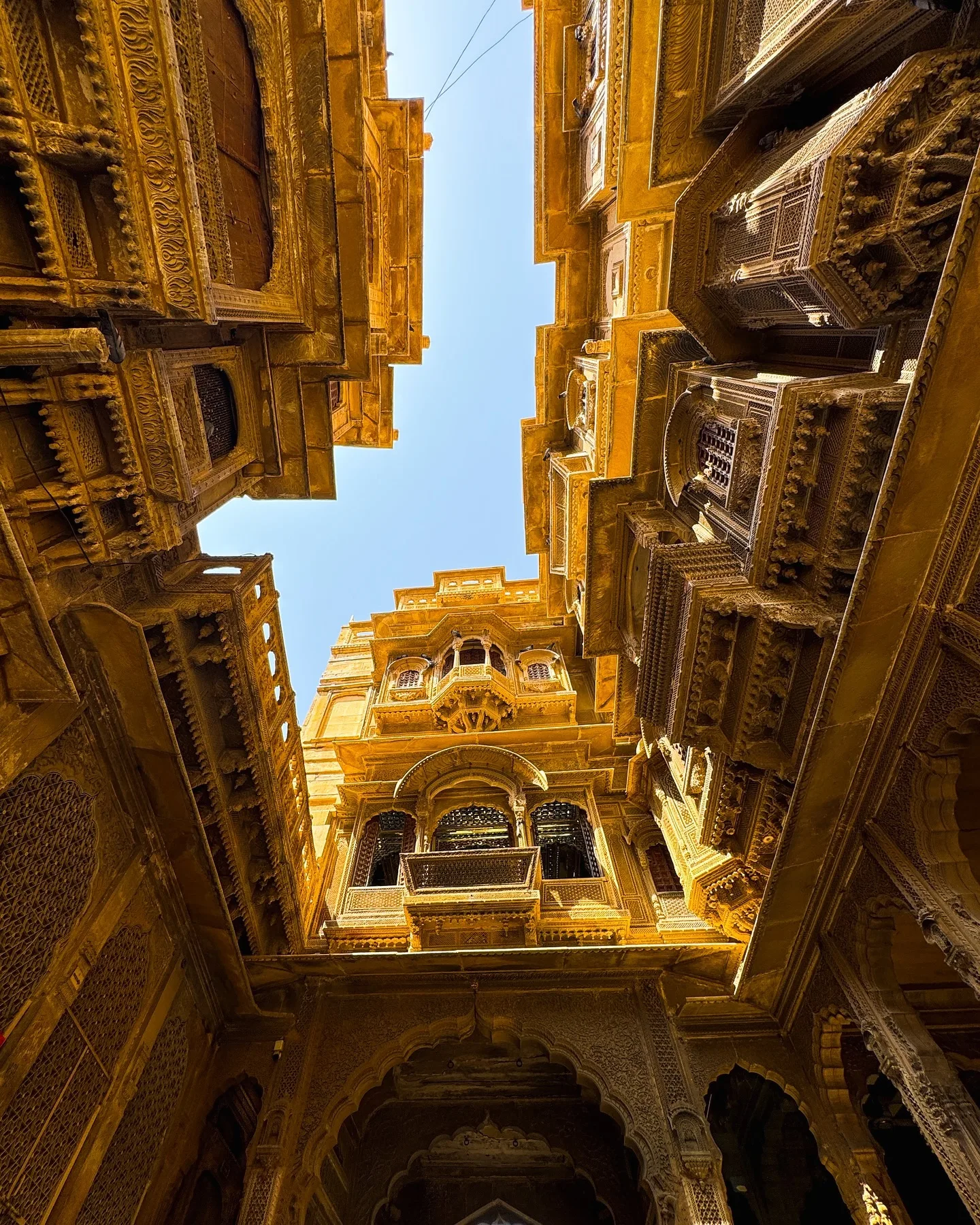 Intricately carved sandstone jharokhas of a historic Jaisalmer haveli